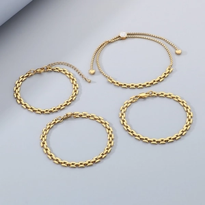 Minimalist gold titanium steel hollow chain bracelets set on a blue-grey background