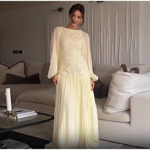 Pale yellow pleated chiffon maxi dress with round neck and long sleeves for women
