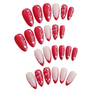 Almond-shaped French style red and pink press-on nails set with heart patterns