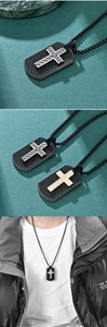 Detailed close-up of men's cross necklace in carbon fiber and steel with model wearing view