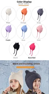 Detail view of colorful kids' knit hats with cat ears and warm earflaps in eight colors
