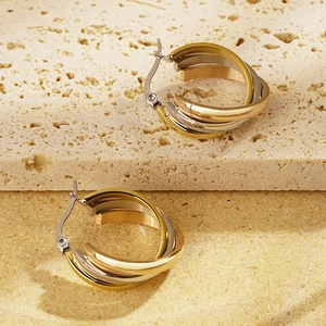 Three-tone interwoven hoop earrings in gold, silver, and rose gold finishes