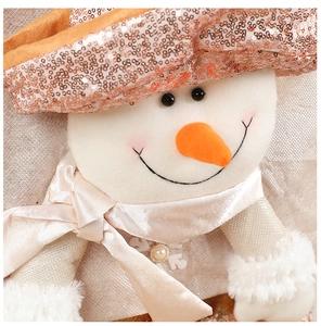 Detail of Christmas snowman chair cover with sequins, plush fabric and pearl accents