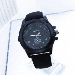 Men's minimalist black quartz watch with large numerals and textured silicone strap