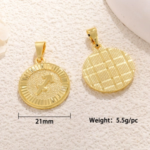 Macro view of 21mm Sagittarius zodiac charm showing textured reverse and polished relief