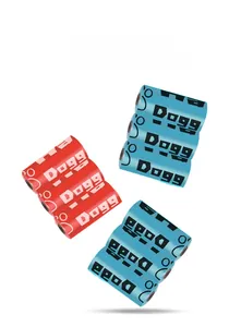 Biodegradable dog waste bag rolls with bone and paw print patterns by Dogg