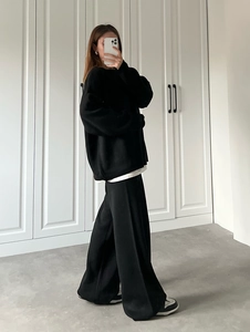 Minimalist black oversized knit sweater and wide-leg trouser set with a relaxed silhouette