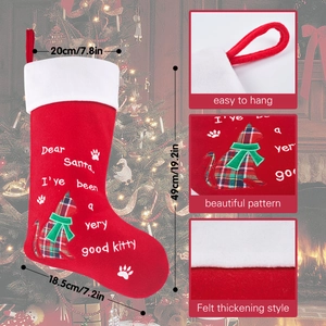 Detailed Christmas stocking view with embroidered cat motif and dimension specifications
