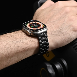 Close-up of black titanium alloy metal link strap on Apple Watch Ultra on wrist