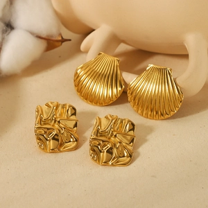 18K gold plated stainless steel shell and irregular rectangle earrings on cream background