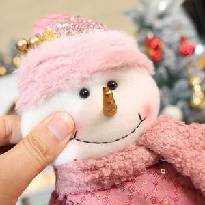 Pink Christmas snowman plush toy with sequined hat and soft scarf for home decor