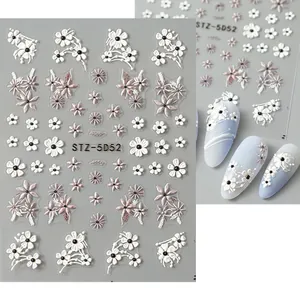 Detailed 5D embossed nail stickers featuring white and purple floral daisy patterns