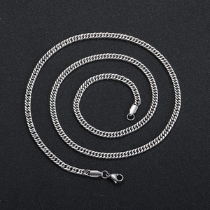 Polished silver 4mm stainless steel Cuban link chain with lobster clasp on black backdrop