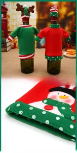 Close-up of snowman embroidery on a festive Christmas wine bottle sweater and mini hat