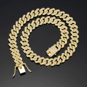 Detailed macro view of high-quality gold plated iced out cuban chain with secure box clasp