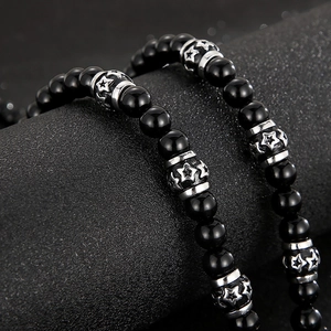 Men's punk style black agate bead necklace featuring silver star embossed metal accents