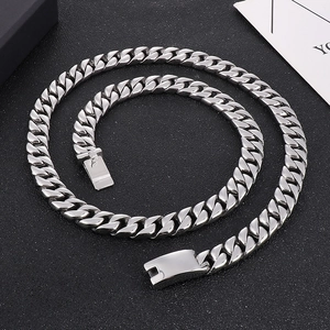 Detail of 12mm silver stainless steel Cuban link chain with a polished square clasp