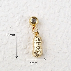 Detail view of a gold peanut pendant with 18mm height and 4mm width measurements
