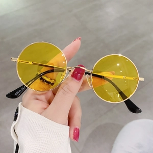 Detailed close-up of retro round sunglasses with yellow lenses and E8030 temple engraving