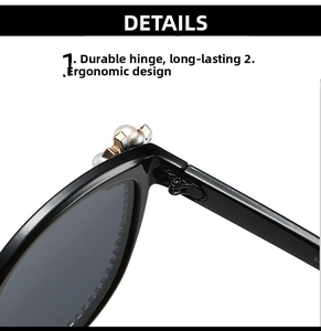 Close-up of sturdy hinges and pearl-embellished frame on black oversized sunglasses
