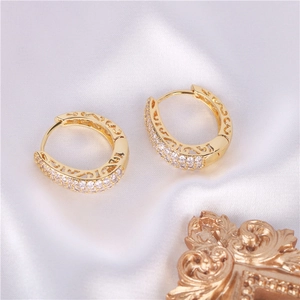 Gold plated hoop earrings with triple row zircon inlay and hollow side patterns