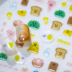 3D embossed cartoon food nail stickers featuring 3D toast, cheese and donut designs