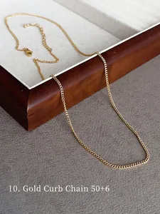 Detailed close-up of a 50+6cm golden curb link chain necklace on a jewelry box display