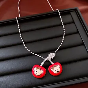 Adjustable silver ball chain necklace with red enamel cherry pendants and bear motif