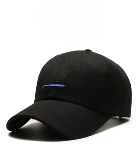 Close-up of blue whale embroidery on high-quality black cotton twill baseball cap