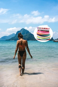 Close-up of layered 6mm clay bead friendship bracelets on a model at the beach