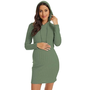 Detail of sage green hooded maternity dress showing ribbed knit texture and slim fit