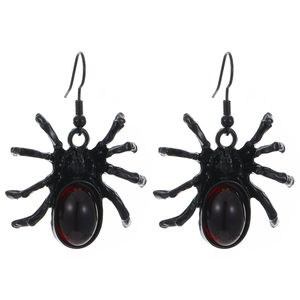 Detailed view of spider earrings with deep red gemstones and black alloy gothic design