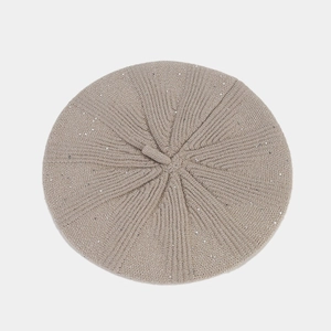 Top view of beige sequin knitted beret showing detailed striped weave and top stem