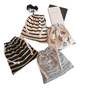 Linen drawstring pouches set with stripe and butterfly patterns and hair scrunchie