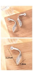 Detailed view of silver wing ear cuff with zircon stones, dimensions 2.27cm by 1.0cm