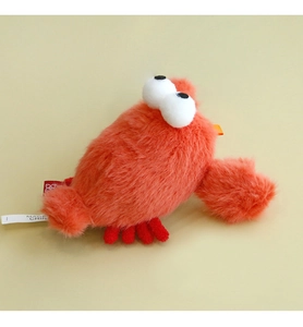 Detail view of red plush crab cat toy with soft texture and small bells for kittens