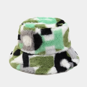 Detailed close-up of fluffy faux fur texture on a patchwork geometric bucket hat