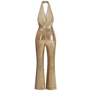 Rear view of gold sequin halter jumpsuit featuring flare legs and an open back design
