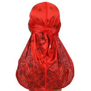Rear view of red paisley durag with long tail and silky satin texture on head model