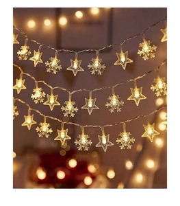 Close-up of warm white LED star and snowflake string lights for festive holiday decoration