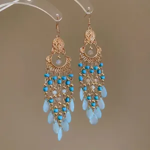 Bohemian vintage tassel earrings with blue and white beads in teardrop fringe design