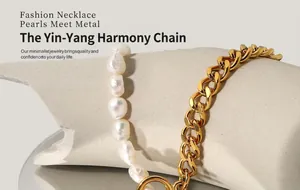 Detail of freshwater baroque pearl and chunky gold curb chain with OT toggle clasp