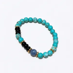 Blue turquoise and black onyx geometric beaded bracelet with gold alloy accents