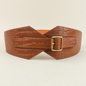 Detail of brown crocodile pattern waist belt with golden square buckle and elastic back