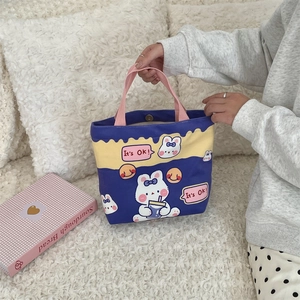 Close-up of cute rabbit canvas tote bag with blue and yellow panels and It's Ok print