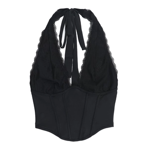 Close-up of black lace corset top with deep V-neck and boning structure detail
