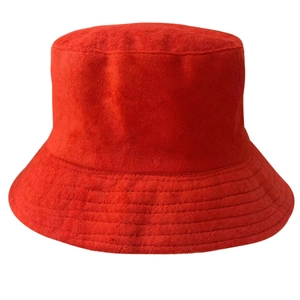 Detailed texture of red terry cloth fabric on a casual bucket hat for winter