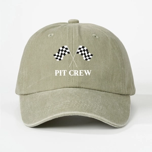 Close-up of the vintage washed cotton texture and Pit Crew embroidery on the racing cap