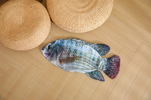 Realistic 3D fish pillow skin showing detailed blue scales and fin textures on wood floor