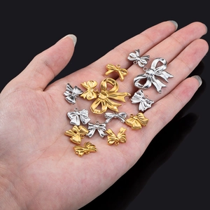 Polished stainless steel bow pendants in gold and silver for DIY jewelry making